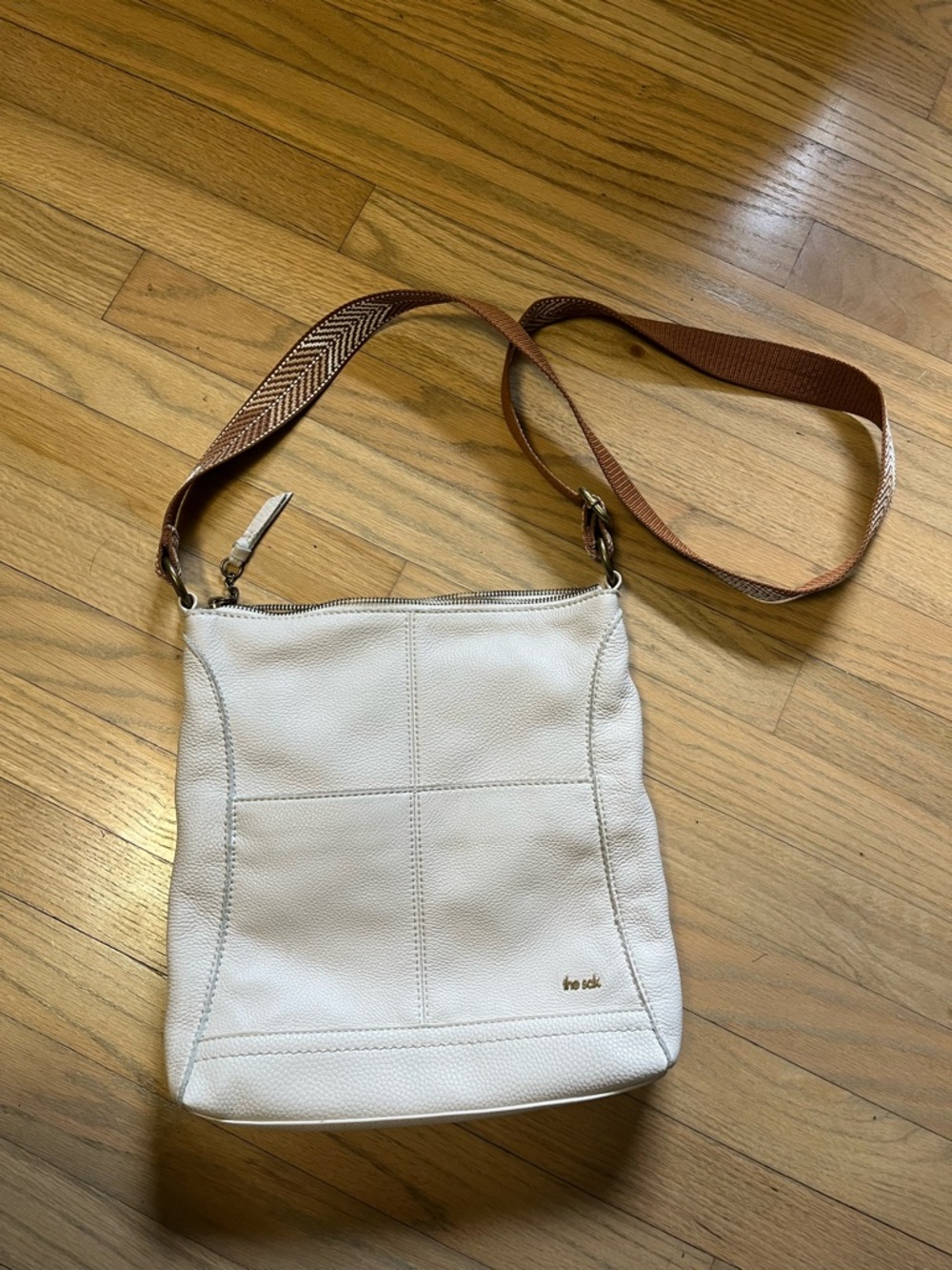 The Sak Cream Leather Crossbody with Brown Webbing Strap